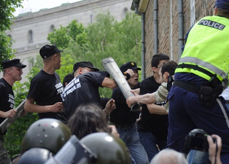 Supporters of the Bulgarian ultra-nationalist party Ataka, or 'Attack, (L), clash with Muslim worshippers during Friday prayer in front of the Banya Bashi Mosque in Sofia, Bulgaria